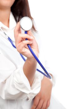 Female doctor holding stethoscope pointed toward camera