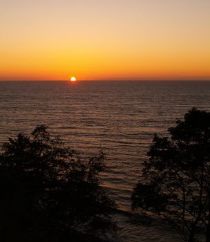 Golden Orange Sunset in a Clear Sky Over the Ocean