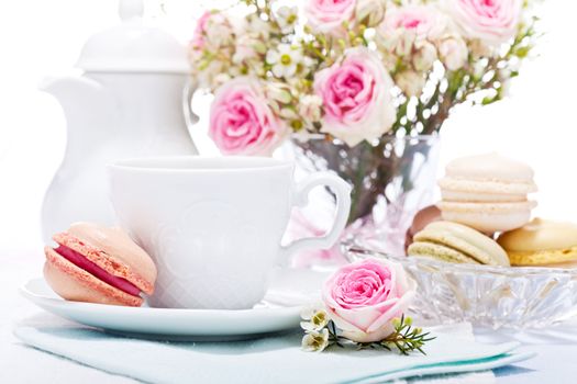 traditional delicious sweet dessert macarons and coffee on table