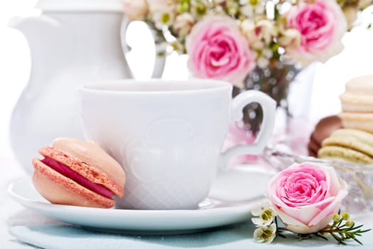 traditional delicious sweet dessert macarons and coffee on table