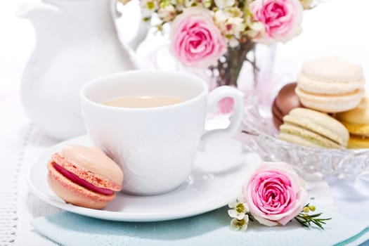 traditional delicious sweet dessert macarons and coffee on table