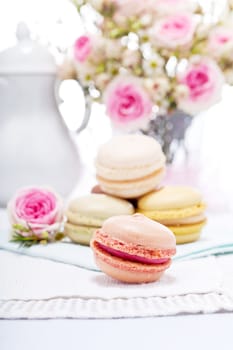 traditional delicious sweet dessert macarons and coffee on table