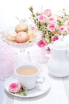 traditional delicious sweet dessert macarons and coffee on table