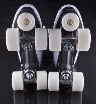 Pair of roller skates seen from below