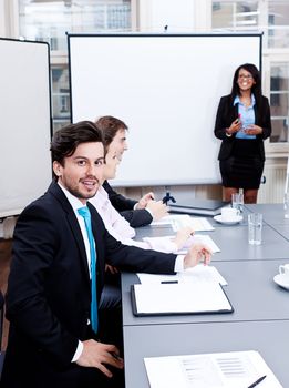 business team on table in office conference seminar presentation