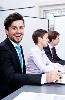 business team on table in office conference seminar presentation