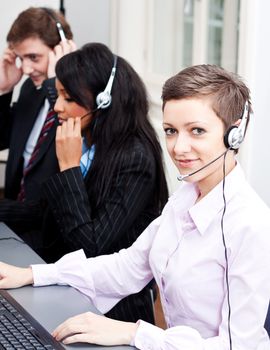 smiling callcenter agent with headset support hotline