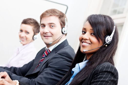 smiling callcenter agent with headset support hotline