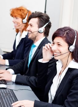 smiling callcenter agent with headset support hotline