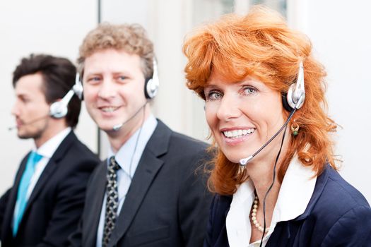 smiling callcenter agent with headset support hotline