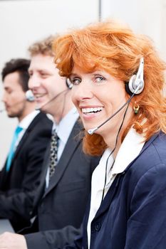 smiling callcenter agent with headset support hotline