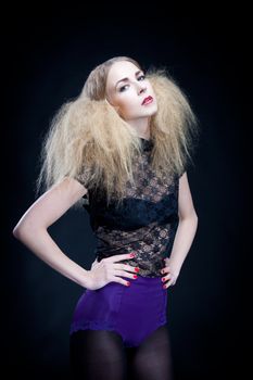 attractive blonde woman with big hair and modern styling fashion posing