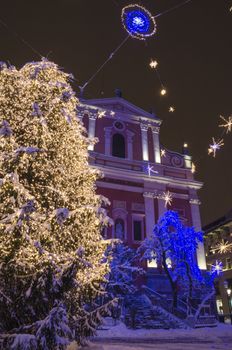 Christmas tree on Preseren square with church behind. Ljubljana, Slovenia, on December 8, 2012.