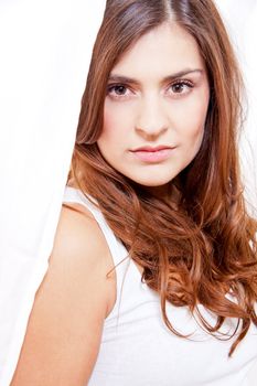 beautiful brunette woman in sunlight at window looking sensual portrait 