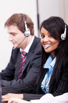 smiling callcenter agent with headset support hotline