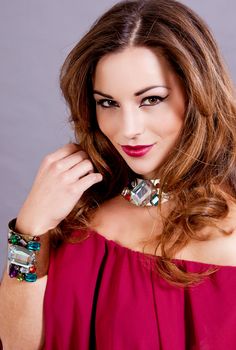 attractive brunette woman with glamour jewellry and make up portrait