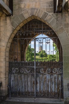 Old and rusty entrance gates of Chateau de la Clayette in Burgundy, France.