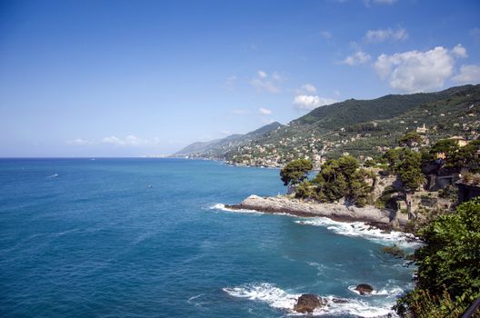 View over Ligurian coastline dissapearing into horizon, Camogli, Italy.