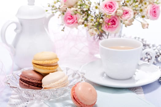 traditional delicious sweet dessert macarons and coffee on table