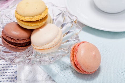 traditional delicious sweet dessert macarons and coffee on table