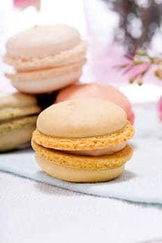 traditional delicious sweet dessert macarons and coffee on table
