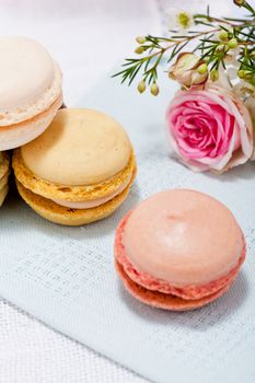 traditional delicious sweet dessert macarons and coffee on table