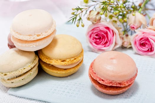 traditional delicious sweet dessert macarons and coffee on table
