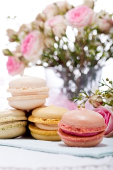 traditional delicious sweet dessert macarons and coffee on table