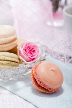 traditional delicious sweet dessert macarons and coffee on table