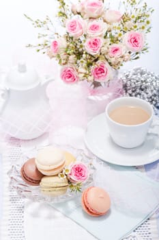 traditional delicious sweet dessert macarons and coffee on table