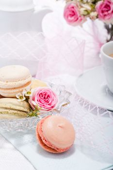 traditional delicious sweet dessert macarons and coffee on table