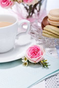 traditional delicious sweet dessert macarons and coffee on table