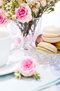 traditional delicious sweet dessert macarons and coffee on table