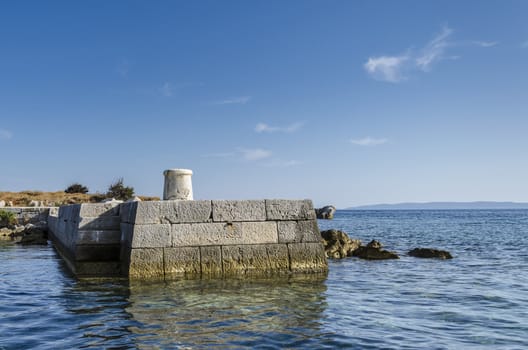 Remote stone pier on island Trstenik, Kornates, Croatia.