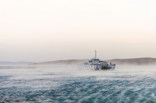 Croatian ferry to island Rab strugling with strong winds.