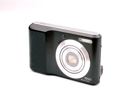 General view of a compact camera with the hulls of black color on a white background