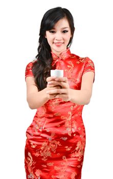 pretty women with Chinese traditional dress Cheongsam and drinking tea on white background