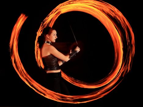 Woman holds in his hand the fire