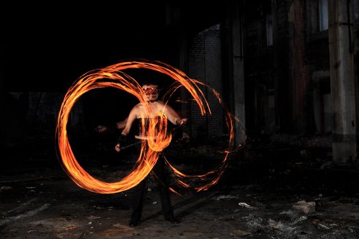 Woman holds in his hand the fire