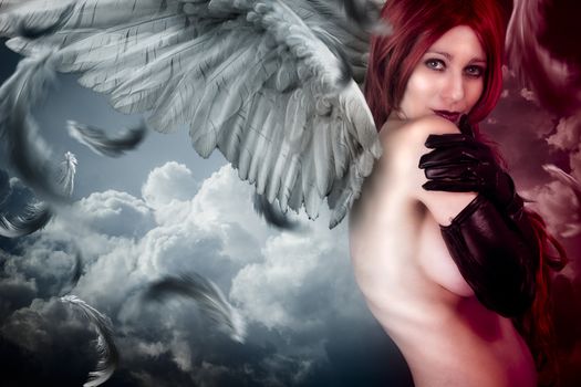 Female angel posing over a cloudy sky