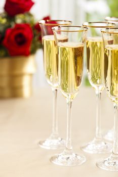 Wedding reception setting with champagne and flowers