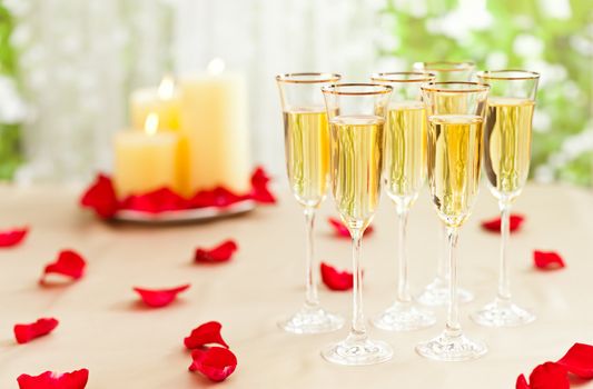 Wedding reception setting with champagne and candles