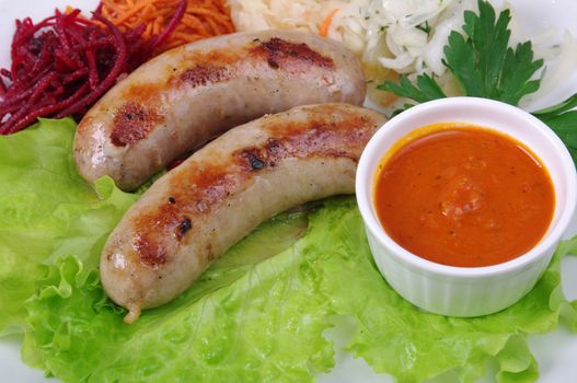 Sausage making roasted with vegetable closeup