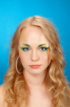 Portrait of beautiful girl  blonde with flowers in her hair 