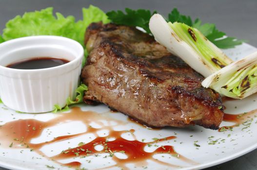 grilled t-bone steak and vegetables