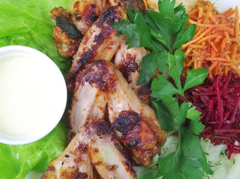 chicken wings with vegetable closeup