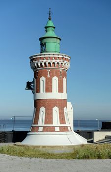 Lighthouse on the background of sea and sky