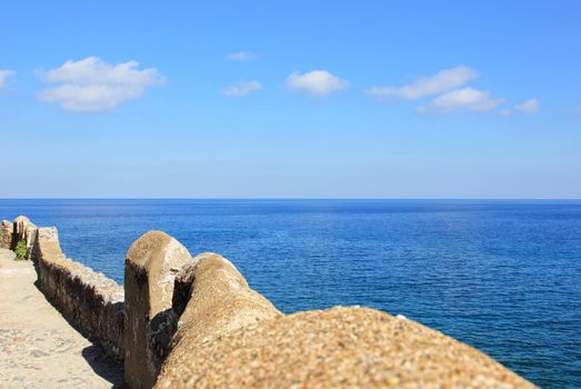 brick wall and sea at monemvasia greece