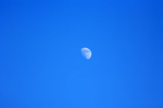 beautiful blue sky with moonlate  in the afternoon