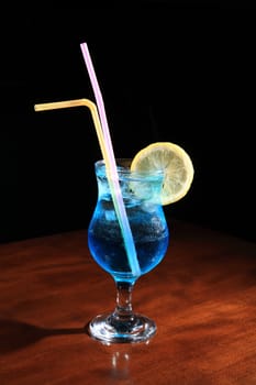 cocktail with vodka and blue curacao on a black background